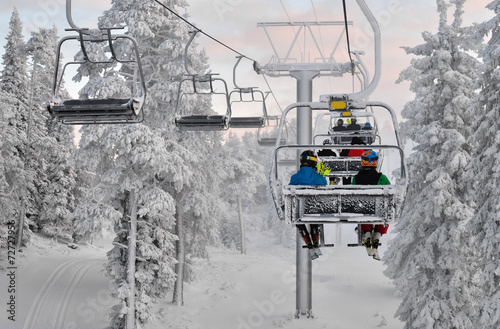Ski chair lift with skiers. Ski resort in Ruka, Finland