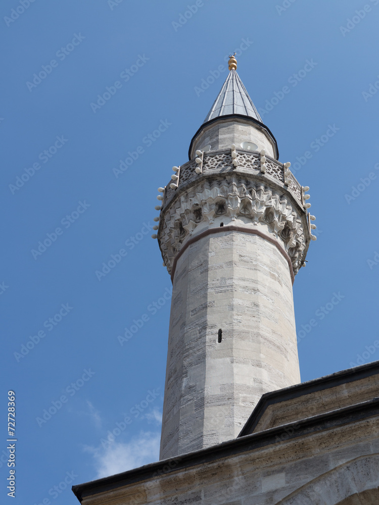Single minaret of an ottoman Mosque in Istanbul