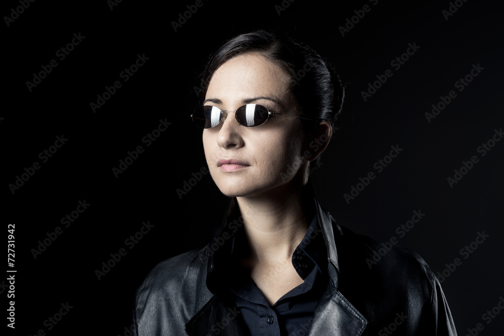 Attractive female agent in black leather coat