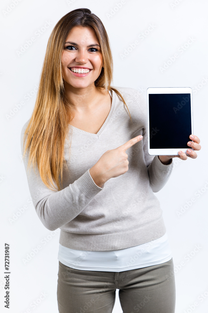 Beautiful woman showing digital tablet. Isolated on white. Beautiful woman showing digital tablet. Isolated on white.