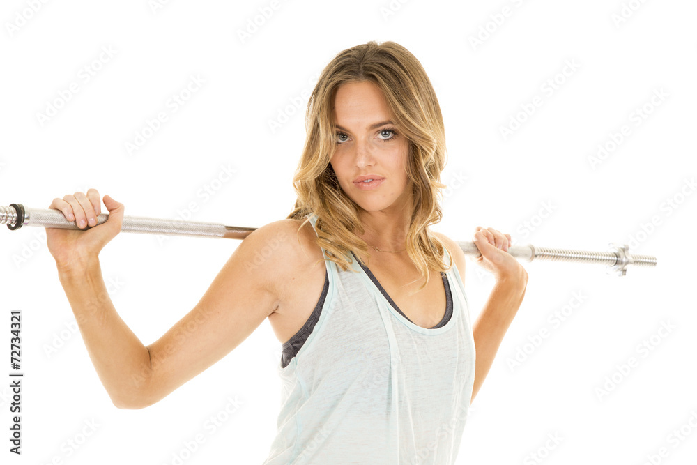 woman green tank fitness bar on back serious woman green tank fitness bar on back serious