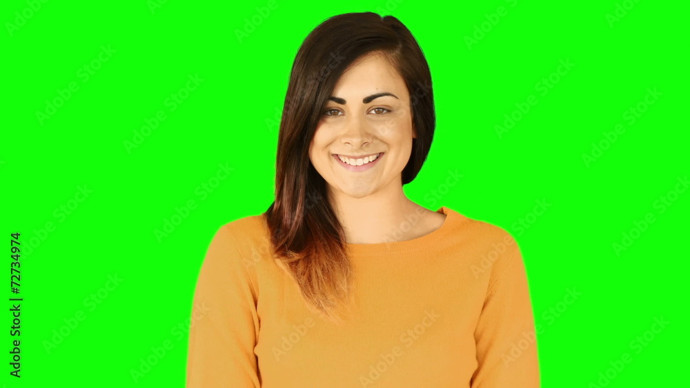 Happy brunette blowing over hands Happy brunette blowing over hands