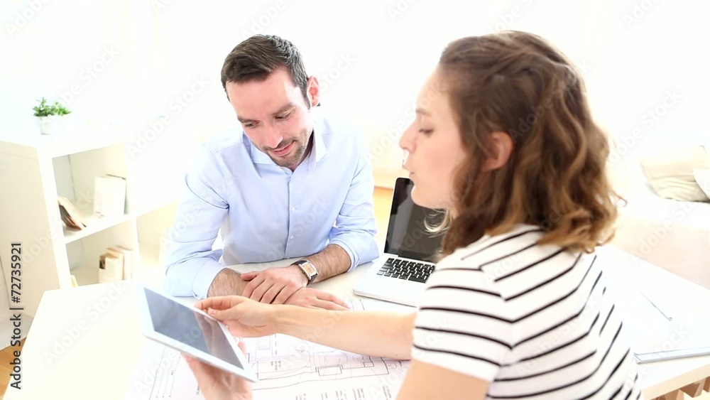 Real estate agent and customer at the office Real estate agent and customer at the office