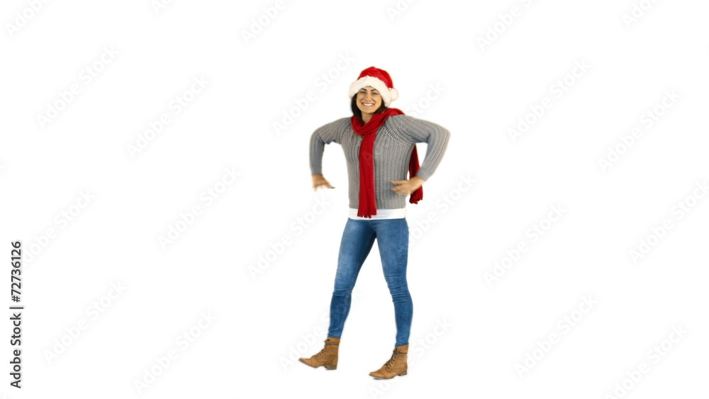 Pretty brunette in santa hat walking and presenting with hand Pretty brunette in santa hat walking and presenting with hand