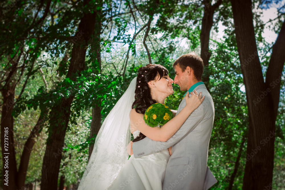 Married Couple in forest embracing Married Couple in forest embracing