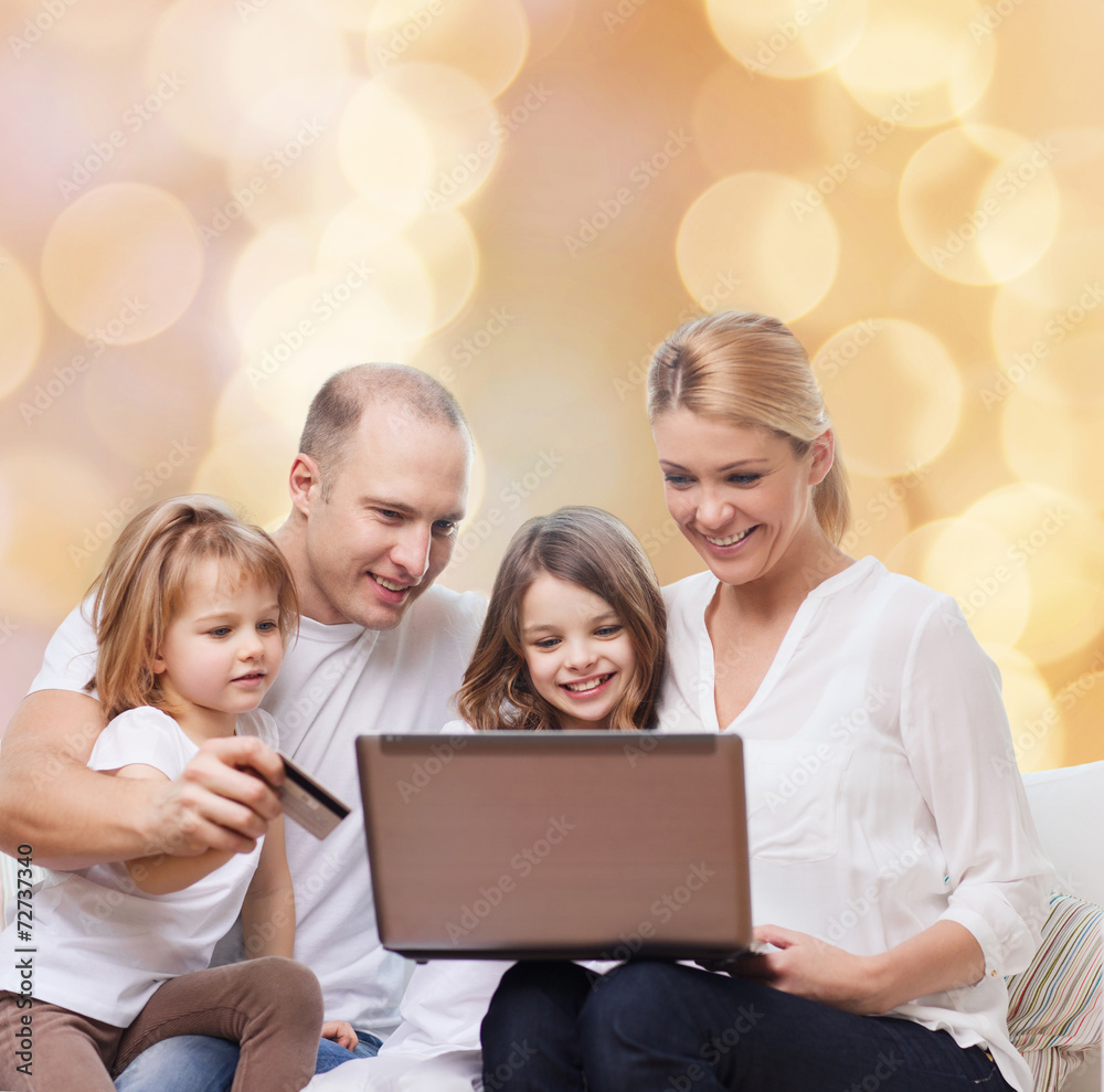 happy family with laptop computer and credit card happy family with laptop computer and credit card