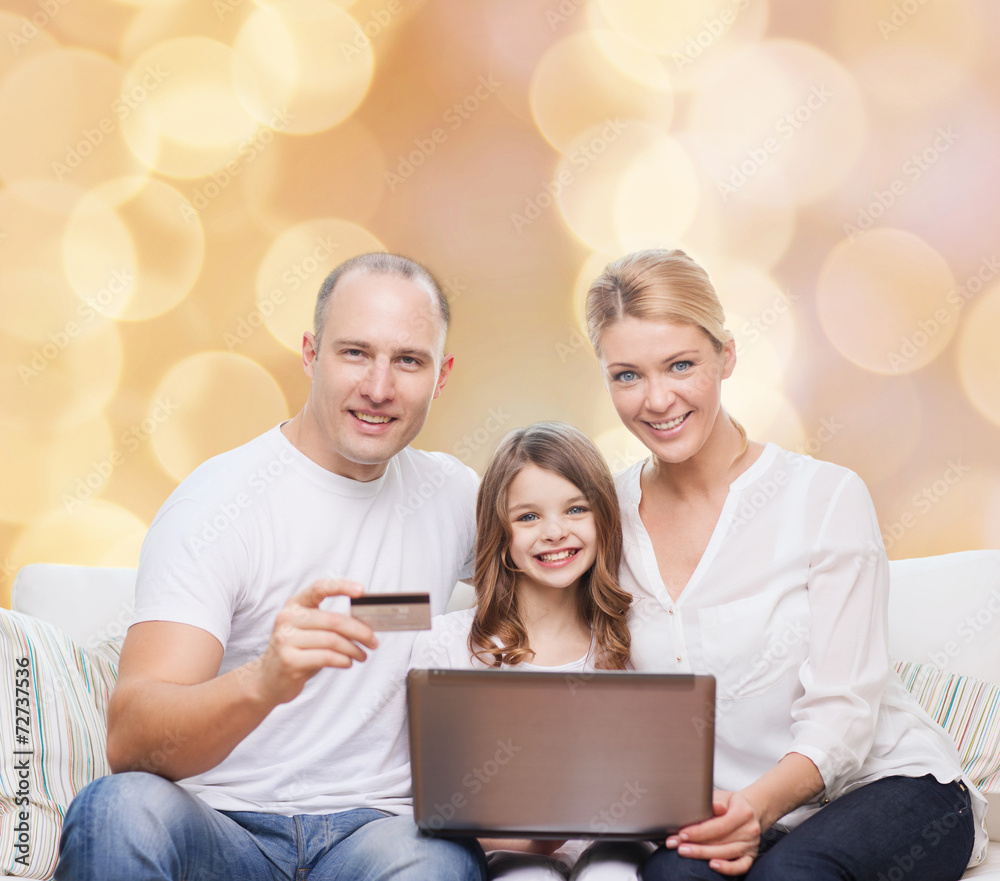 happy family with laptop computer and credit card happy family with laptop computer and credit card