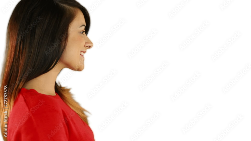 Pretty brunette blowing over hands while looking at camera Pretty brunette blowing over hands while looking at camera