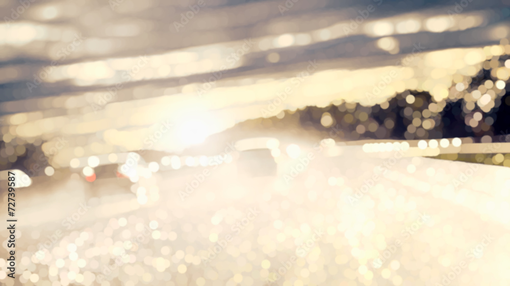Driving on a wet road against the light Driving on a wet road against the light