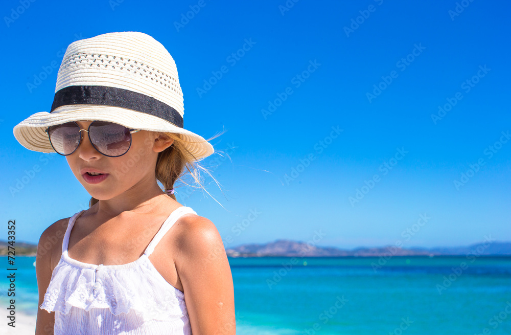 Portrait of Little happy girl enjoying beach vacation
