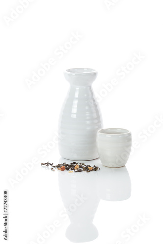 white jug and shot of sake and bulk of tea