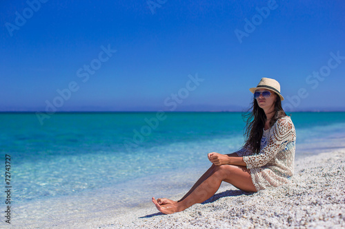 Young beautiful girl enjoying beach tropical vacation