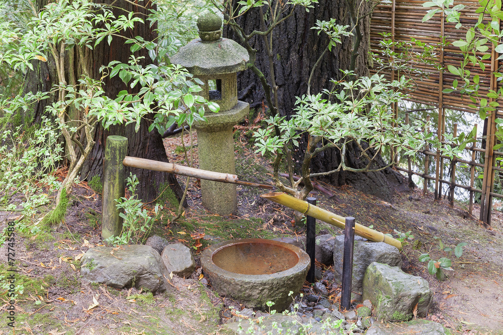Tsukubai Water Fountain and Stone Lantern in Japanese Garden Tsukubai Water Fountain and Stone Lantern in Japanese Garden