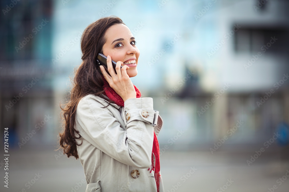 Beautiful young woman on the street on the phone Beautiful young woman on the street on the phone