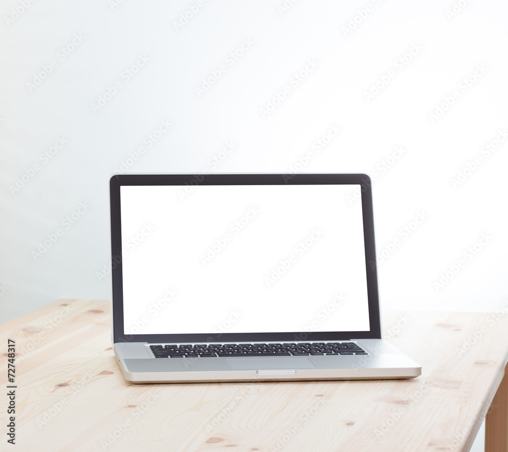 Blank screen laptop computer on wood table