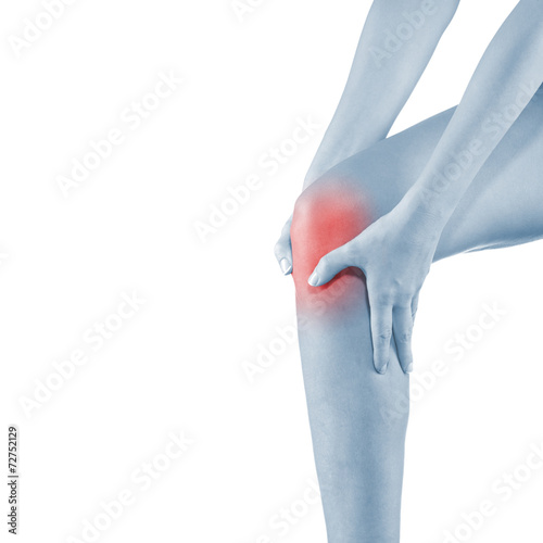 Woman holding injured knee. © Lovrencg