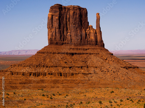 Towering sandstone butte in Monument Valley