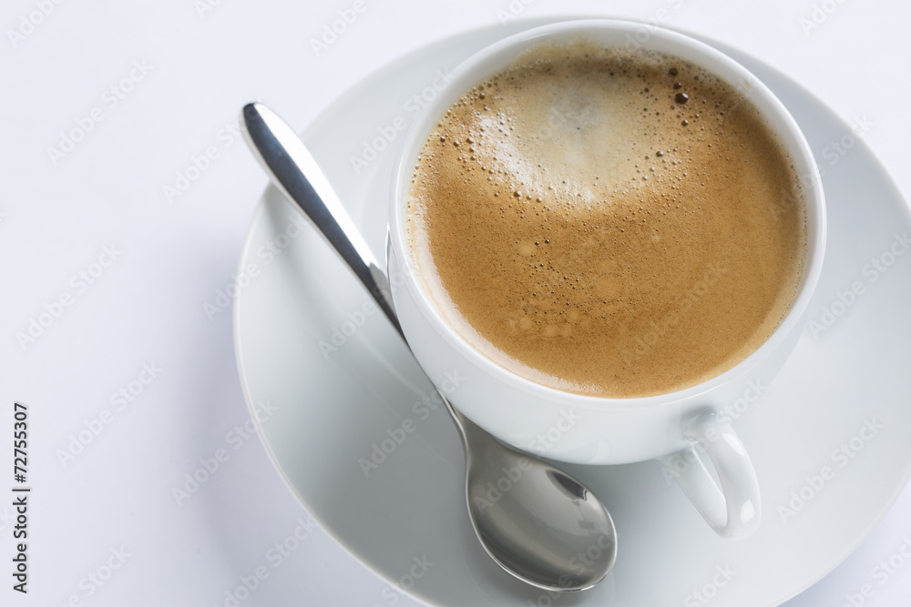 Obraz premium Cup of coffee on a white plate on white background