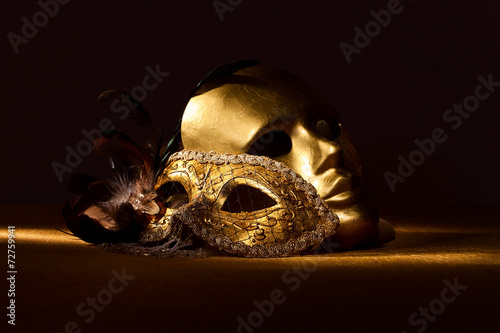 Two golden Venetian masks