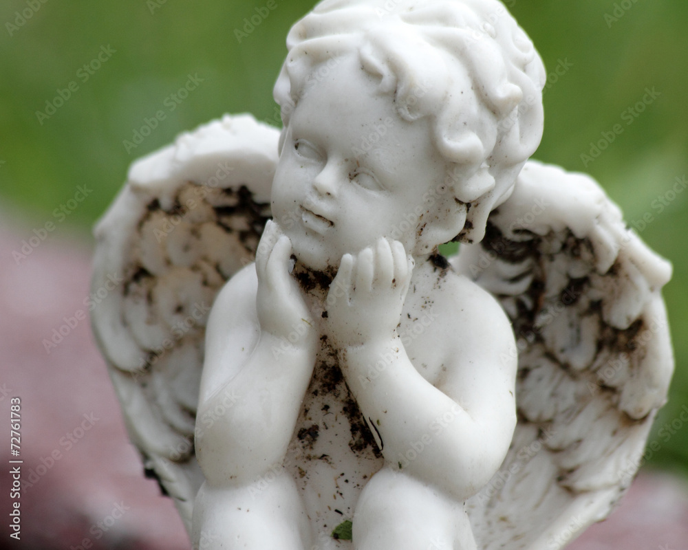 sweet angelic figurine isolated on green and pink background sweet angelic figurine isolated on green and pink background