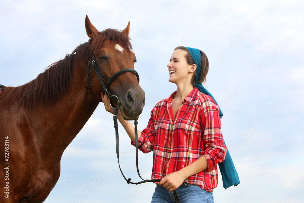Obraz premium Portrait of young woman with her horse