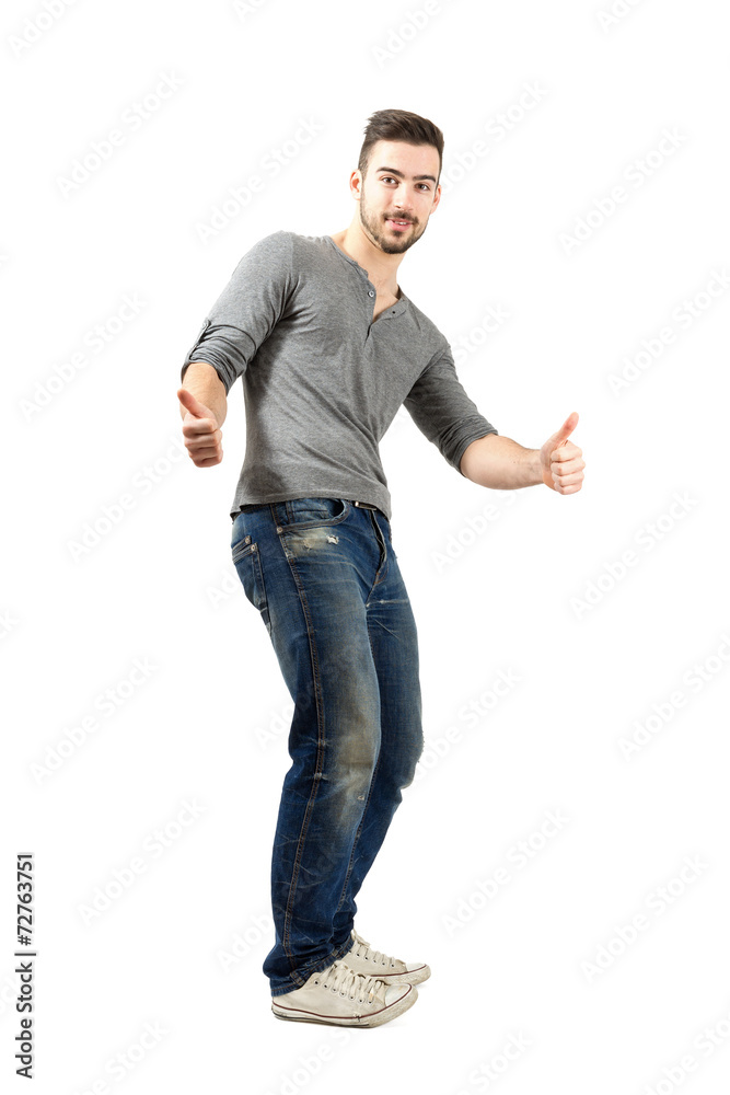 Cheerful trendy guy showing thumbs up Cheerful trendy guy showing thumbs up