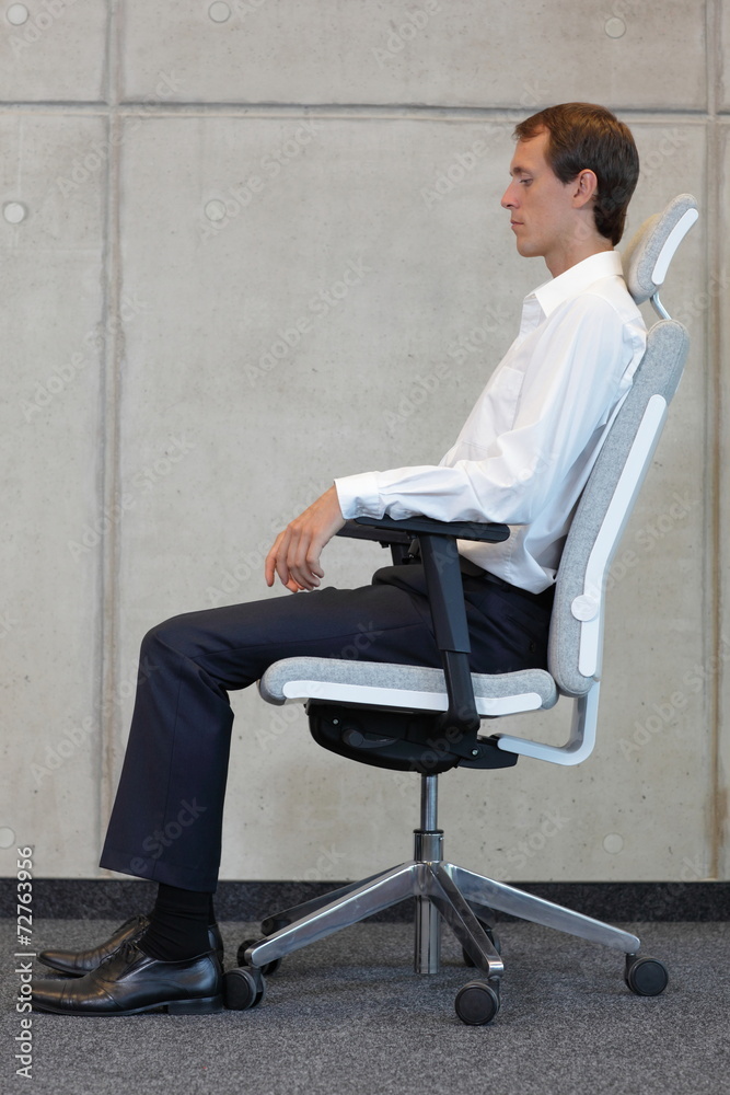 business man on chair in correct sitting position - resting business man on chair in correct sitting position - resting