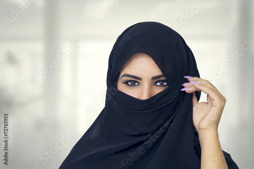 Beautiful Muslim girl wearing burqa closeup photo