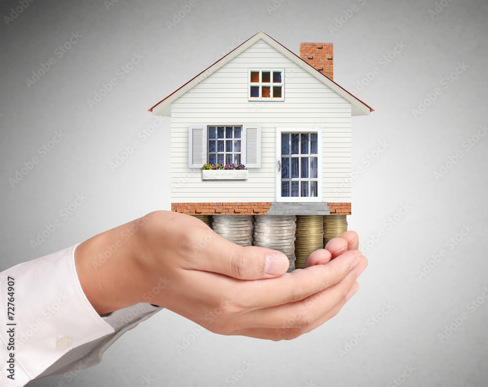 holding house representing home ownership holding house representing home ownership