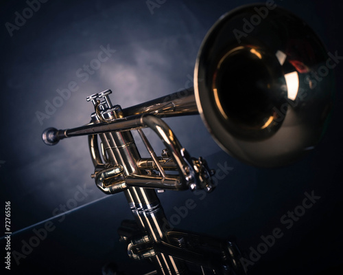 Trumpet in front of blue wrinkled background