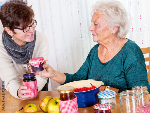 Two women talk about the homemade jam