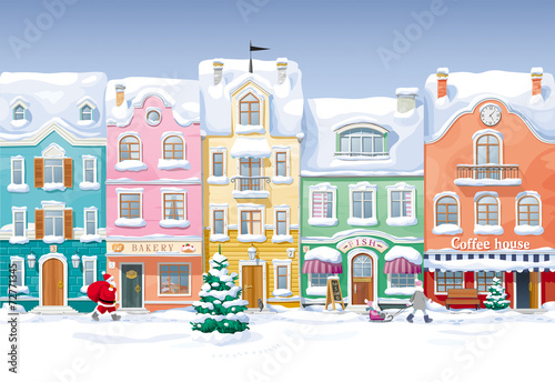 Old historical houses, shops and cafe at the snow-covered city s