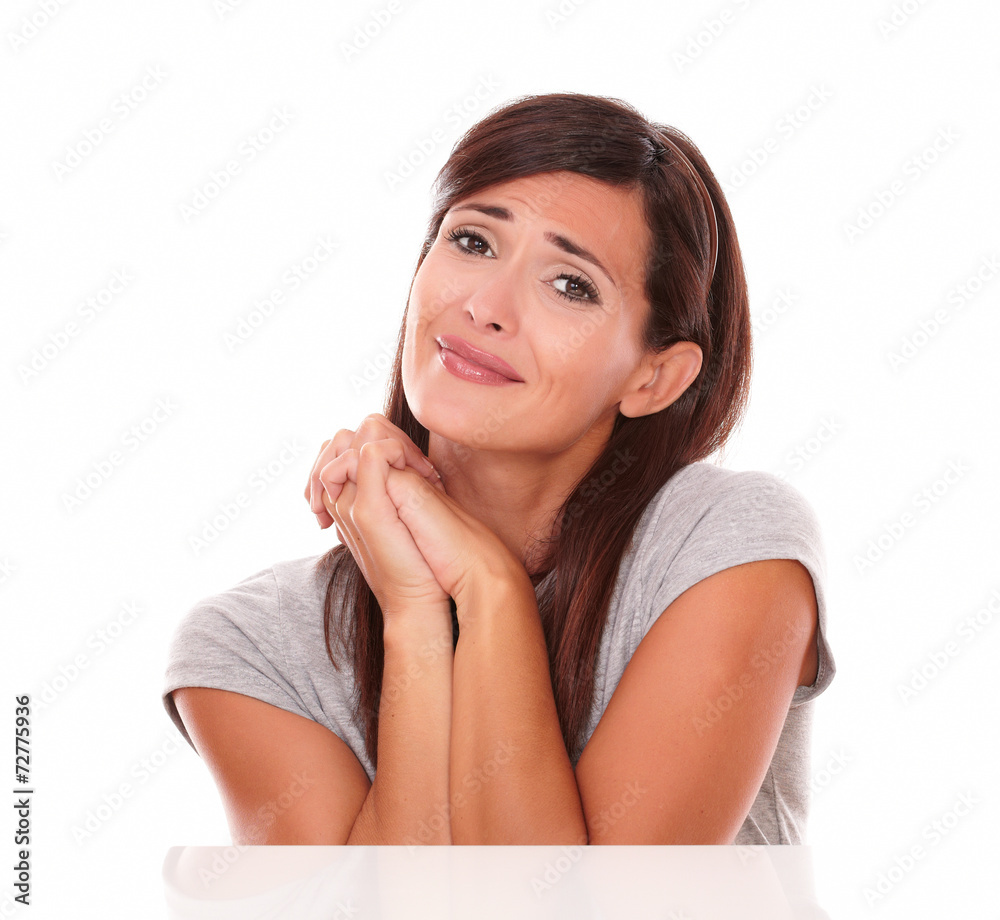 Fototapeta premium Attractive latin woman with wishing gesture