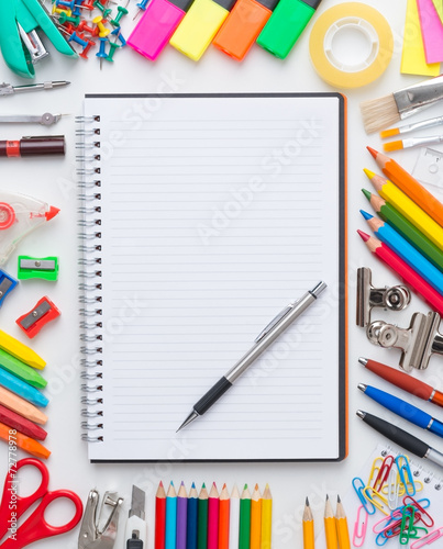 Blank notebook with colourful crayons