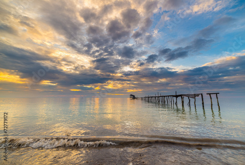 Abandoned wooden jetty at dusk