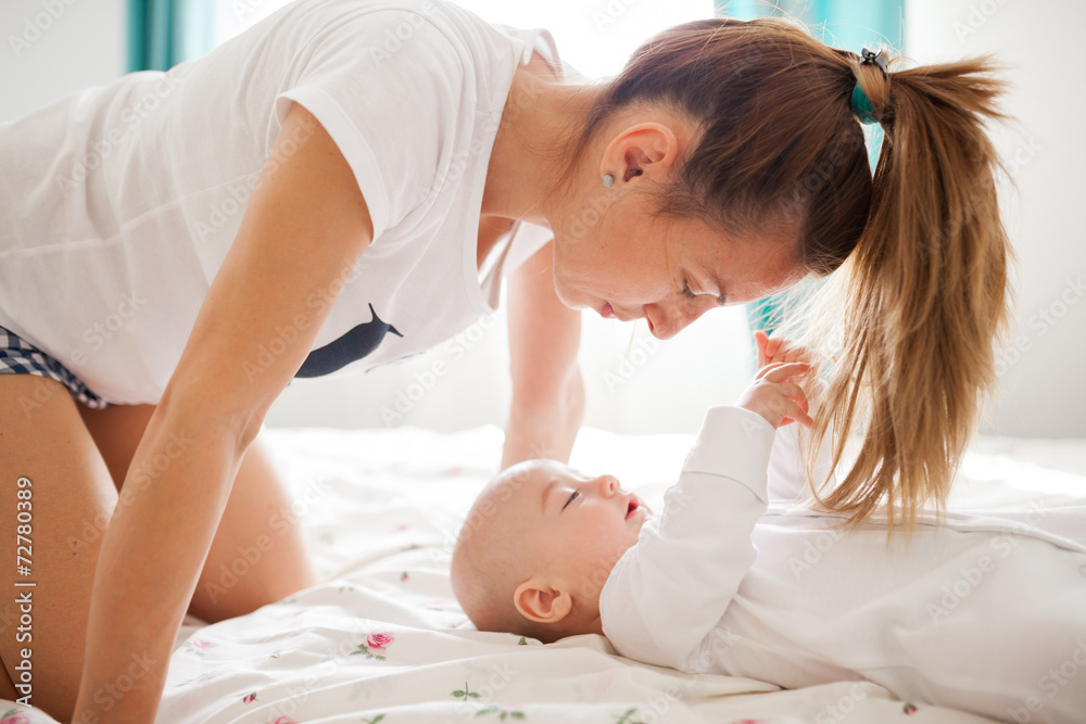 Baby playing with mom's hair Baby playing with mom's hair
