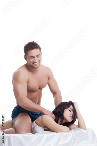 Smiling man doing massage to his mistress