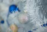 Christmas toys in the form of balls, stars, beads, garlands hang