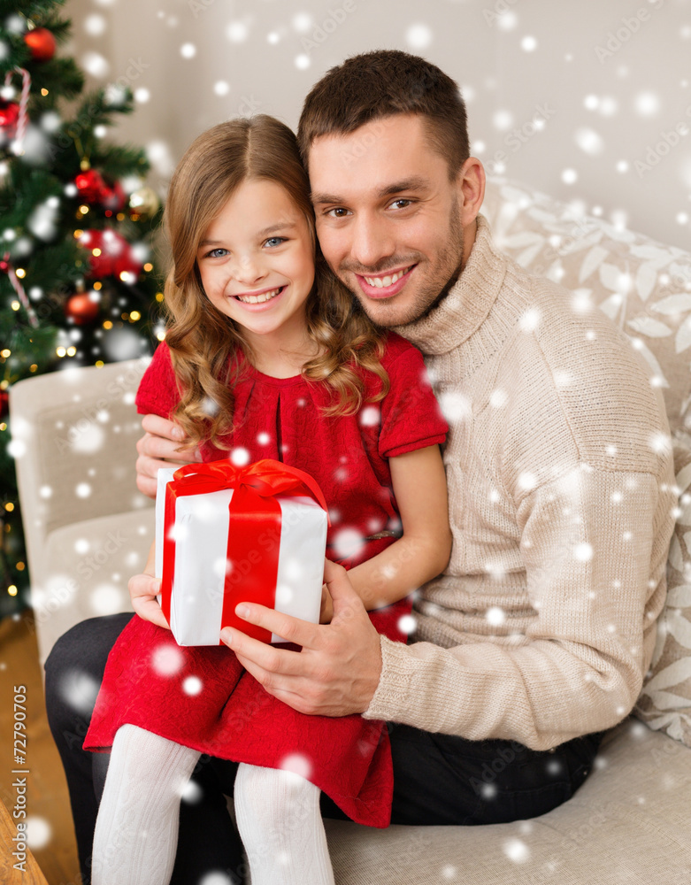 smiling father and daughter holding gift box smiling father and daughter holding gift box