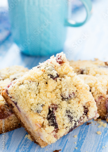 Fruit cake with streusel with cup of milk