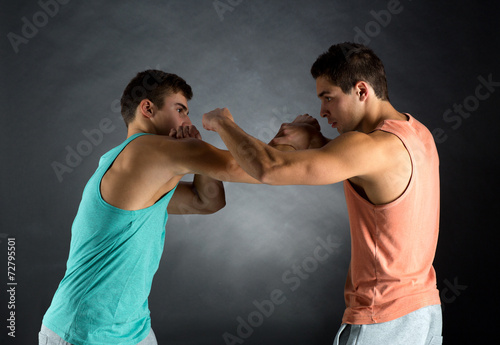 young men wrestling