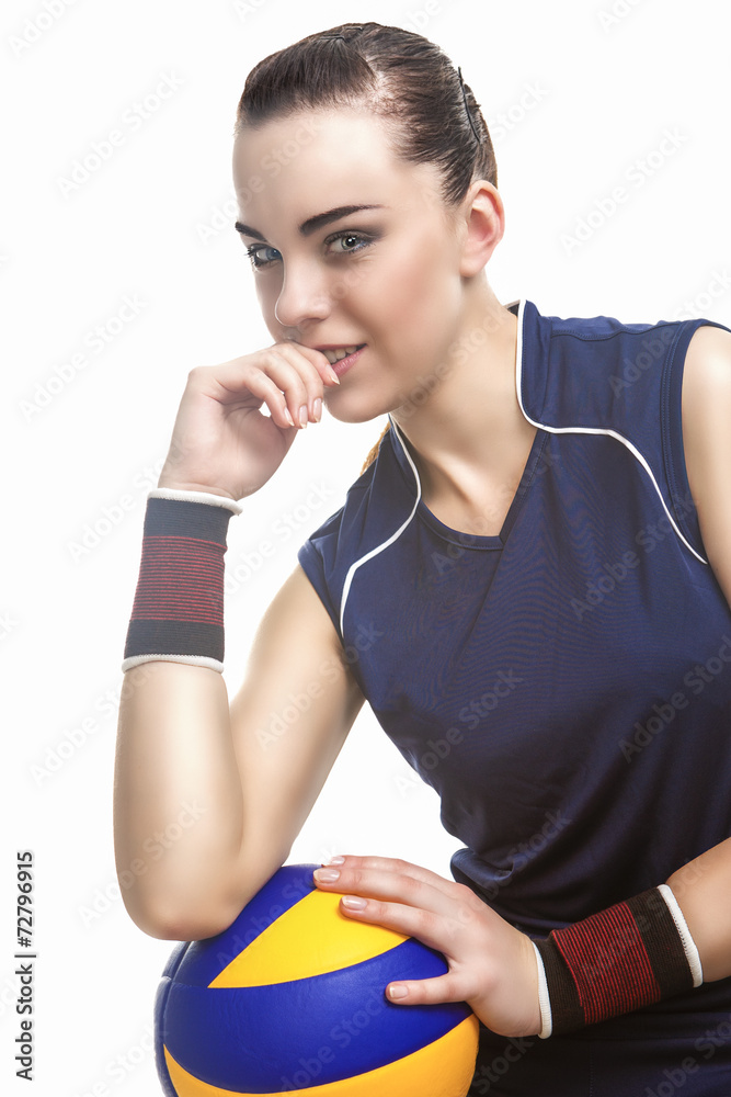 Caucasian Female Professional Volleyball Athlete Sitting and Hol Caucasian Female Professional Volleyball Athlete Sitting and Hol