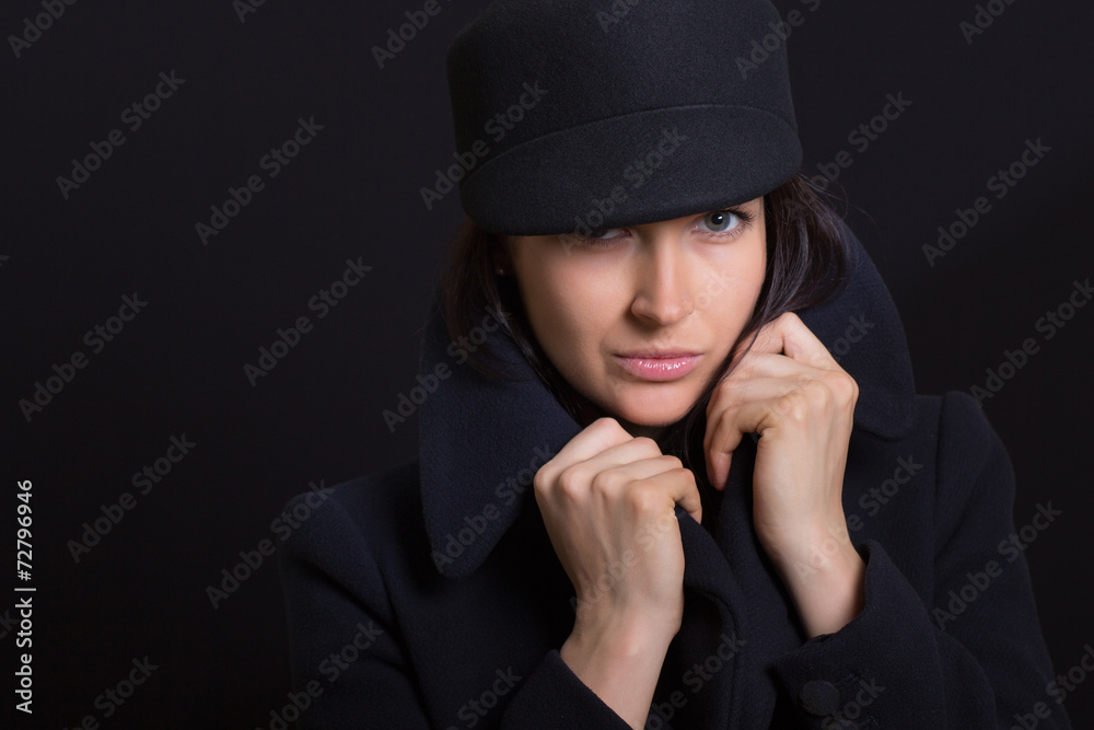 the attractive woman in a cap