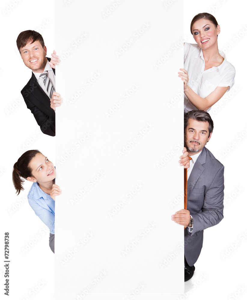 Happy Businesspeople Hiding Behind Large Billboard Happy Businesspeople Hiding Behind Large Billboard