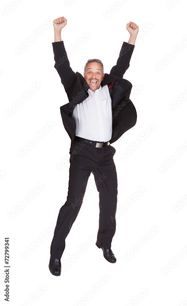 Successful Businessman Jumping With Hands Raised Successful Businessman Jumping With Hands Raised