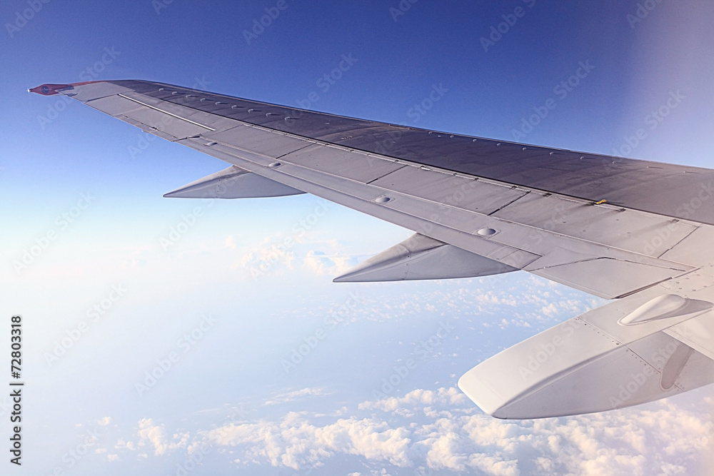 airplane wing in the clouds airplane wing in the clouds