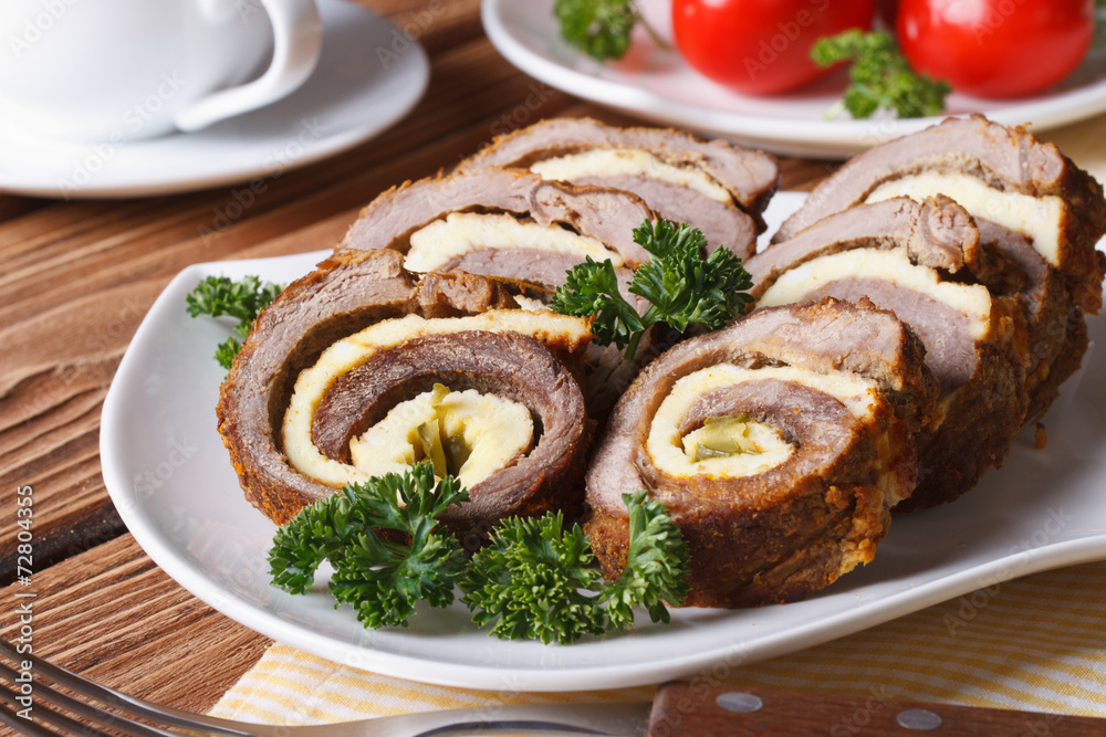 Delicious chopped beef roll with egg on a white plate Delicious chopped beef roll with egg on a white plate