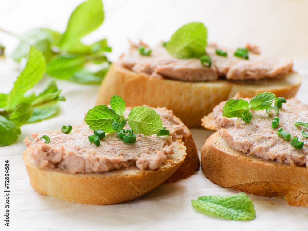Sandwiches with paste and green onions. Served with mint sprigs.