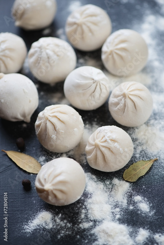 Close-up of raw georgian traditional khinkali, vertical shot