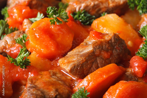 stew in tomato sauce and vegetables macro horizontal. Background